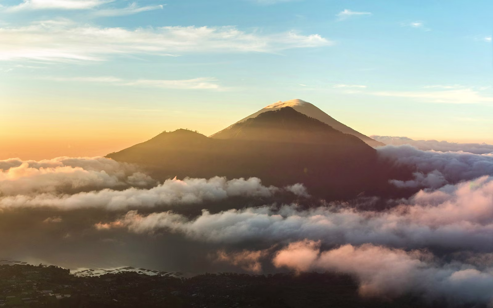 Mount Batur sunrise above a sea of clouds, Kintamani volcano viewpoint Bali